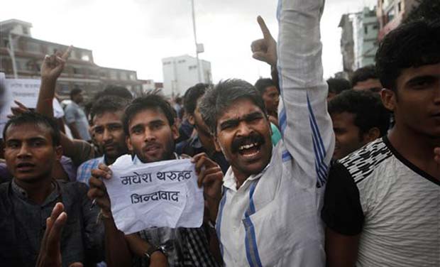 Activists of Nepal's Madhesi group protest against the new constitution outside the Constituent Assembly hall in Kathmandu. (Photo: AP) Activists of Nepal's Madhesi group protest against the new constitution outside the Constituent Assembly hall in Kathmandu. (Photo: AP)